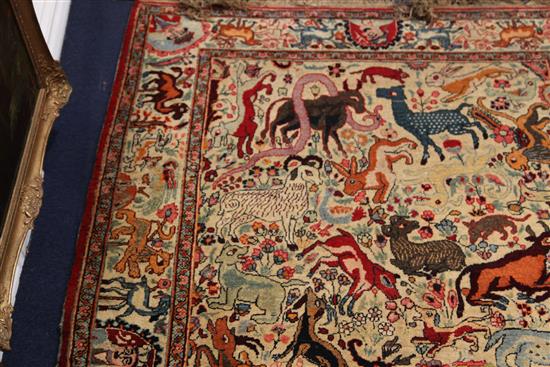 An early 20th century Kirman hunting rug, 6ft 5in by 4ft 2in.